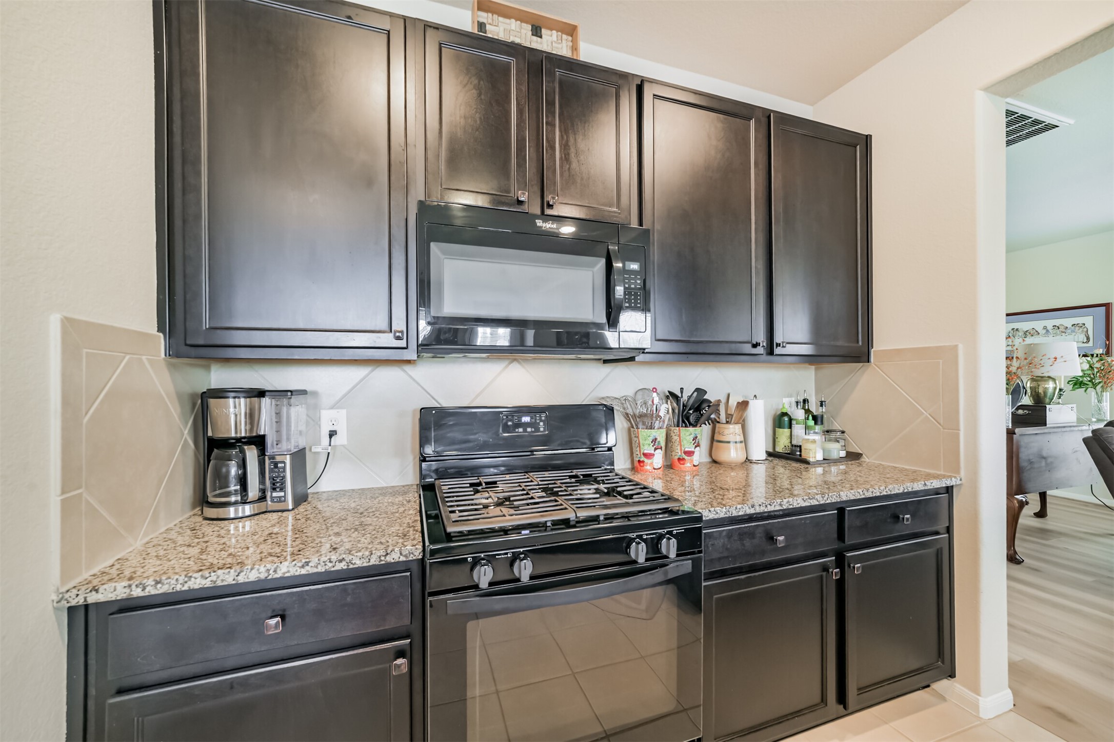12009 La Salle River Road Conroe, TX 77304 - Photo 15 of 50 a kitchen with granite countertop cabinets stainless steel appliances and a counter space