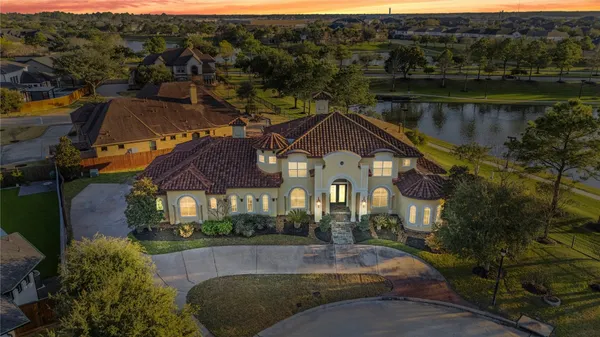 a aerial view of a house with a yard