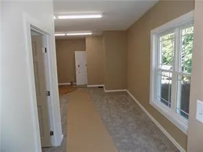 wooden floor and window in an empty room