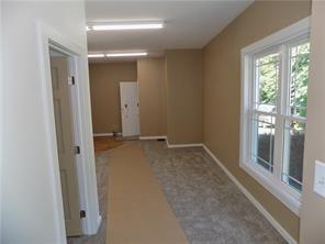 2031 Main Street Cardale, PA 15420 - Photo 2 of 10 wooden floor and window in an empty room