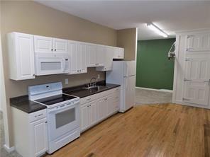 2031 Main Street Cardale, PA 15420 - Photo 4 of 10 a kitchen with granite countertop a stove and a sink
