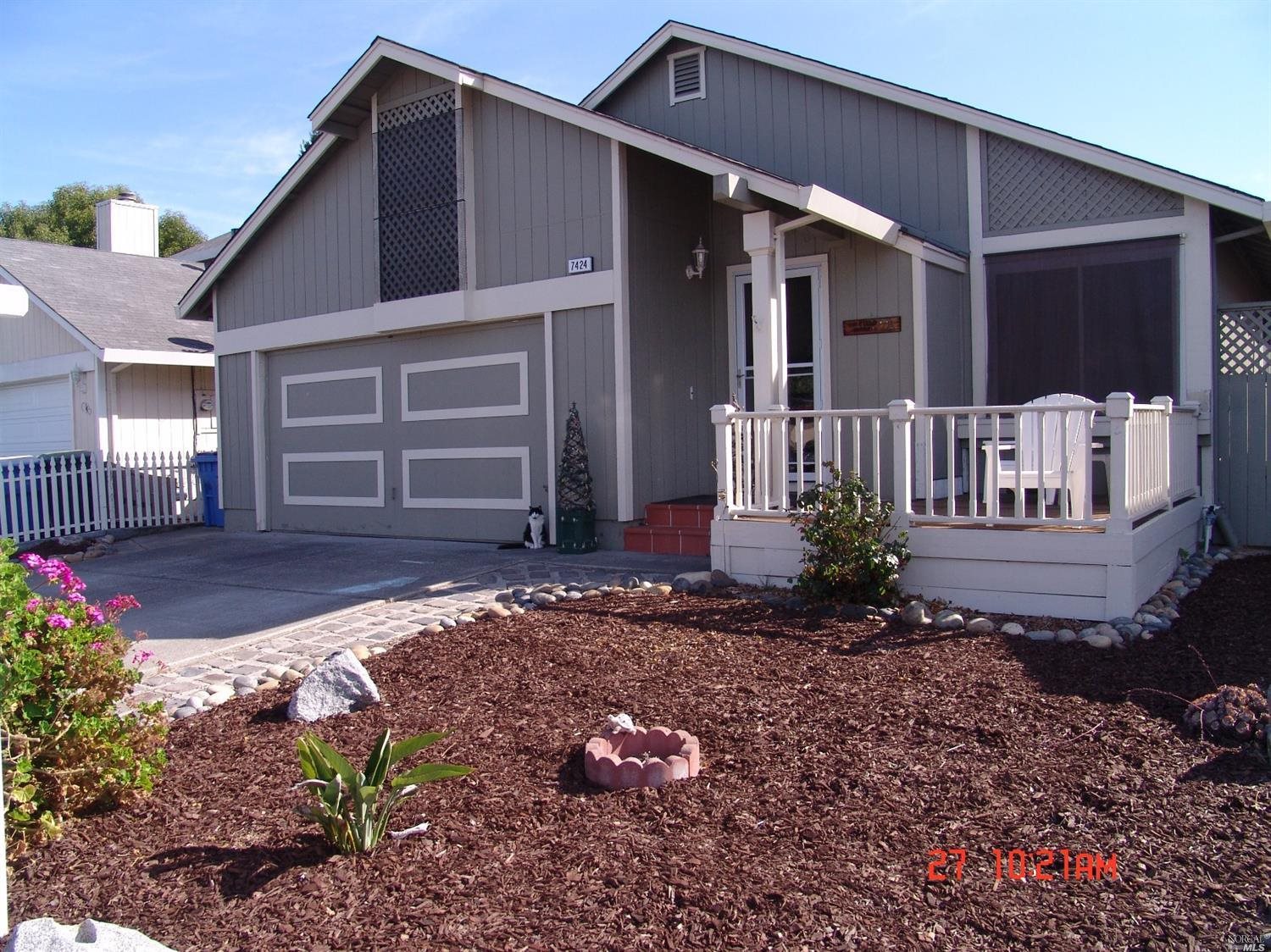 7424 Mitchell Drive Rohnert Park, CA 94928 - Photo 1 of 1 a front view of a house with garden