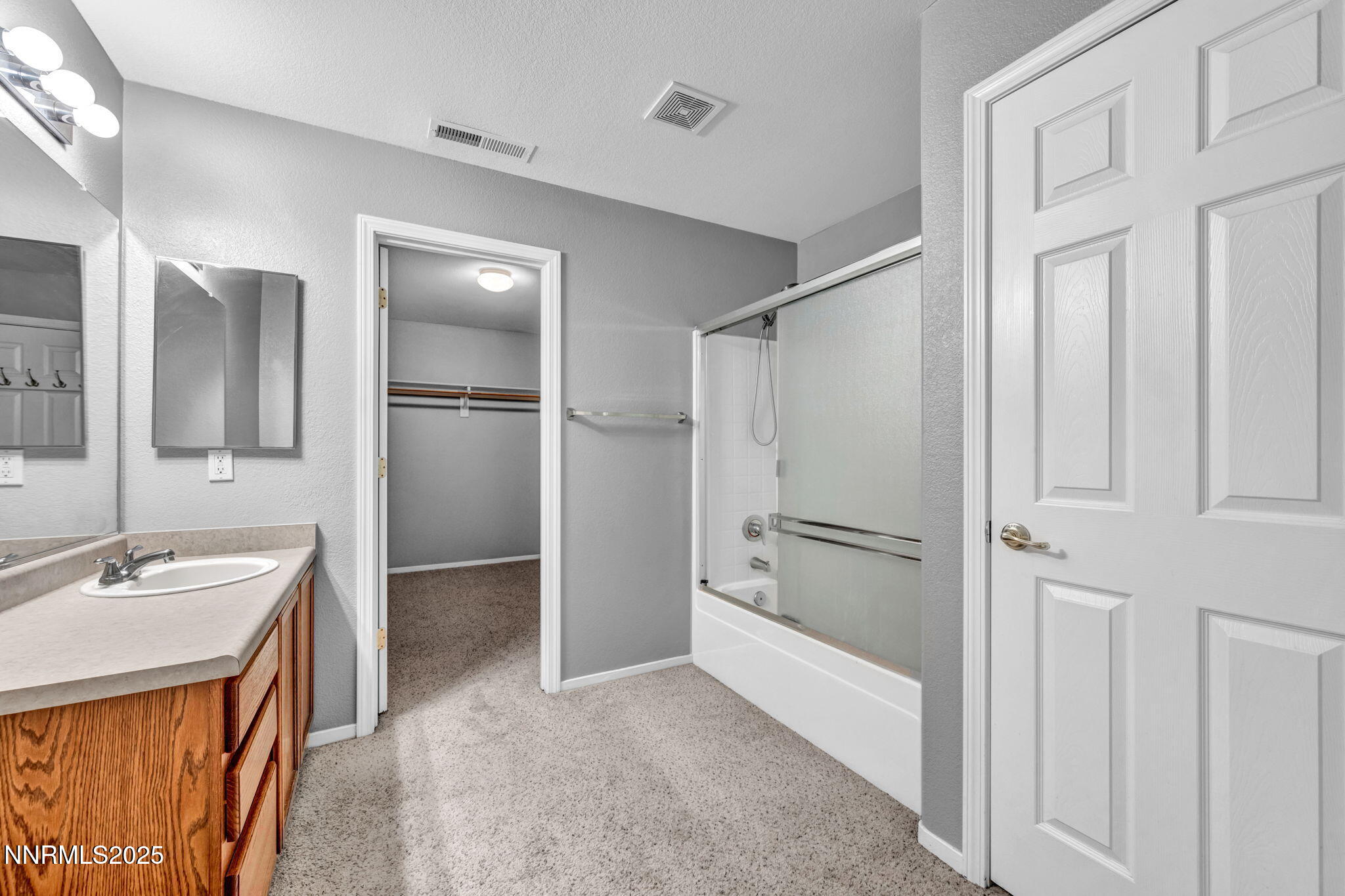 7644 Corso Street Reno, NV 89506 - Photo 30 of 54 a bathroom with a sink and a mirror