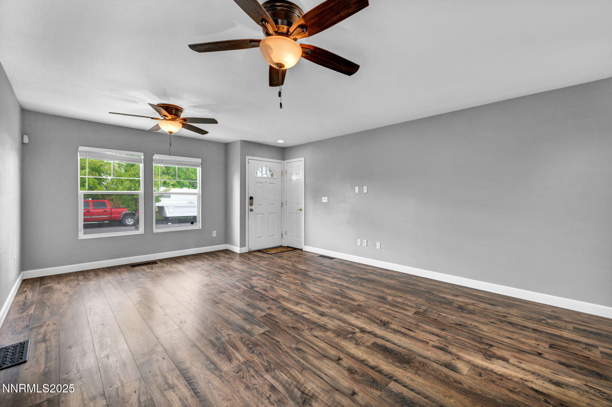 7644 Corso Street Reno, NV 89506 - Photo 3 of 54 wooden floor in an empty room with a window