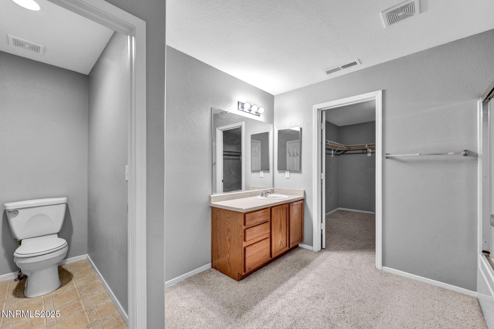 7644 Corso Street Reno, NV 89506 - Photo 31 of 54 a bathroom with a sink toilet and shower