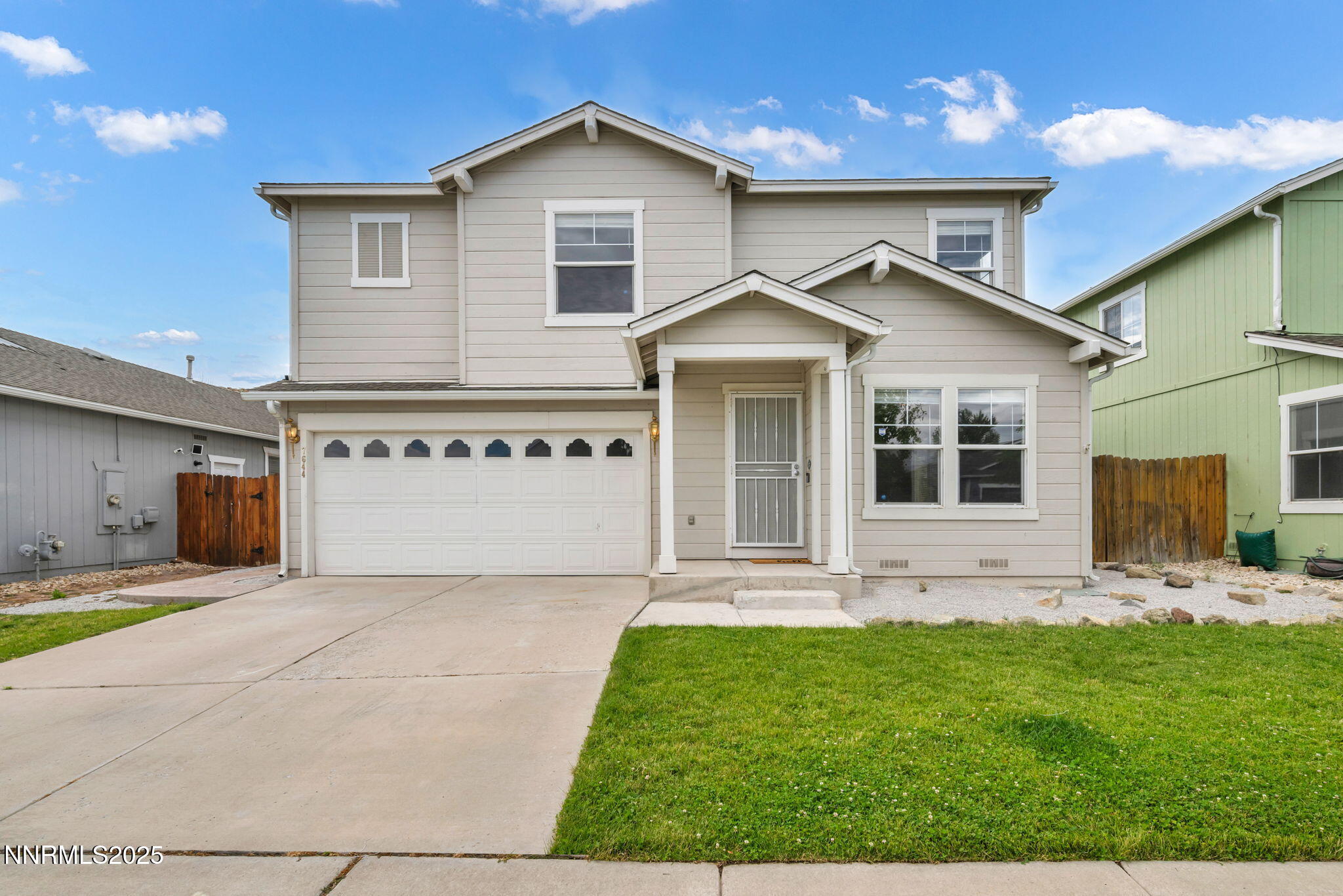 7644 Corso Street Reno, NV 89506 - Photo 4 of 54 a front view of a house with a yard and outdoor seating