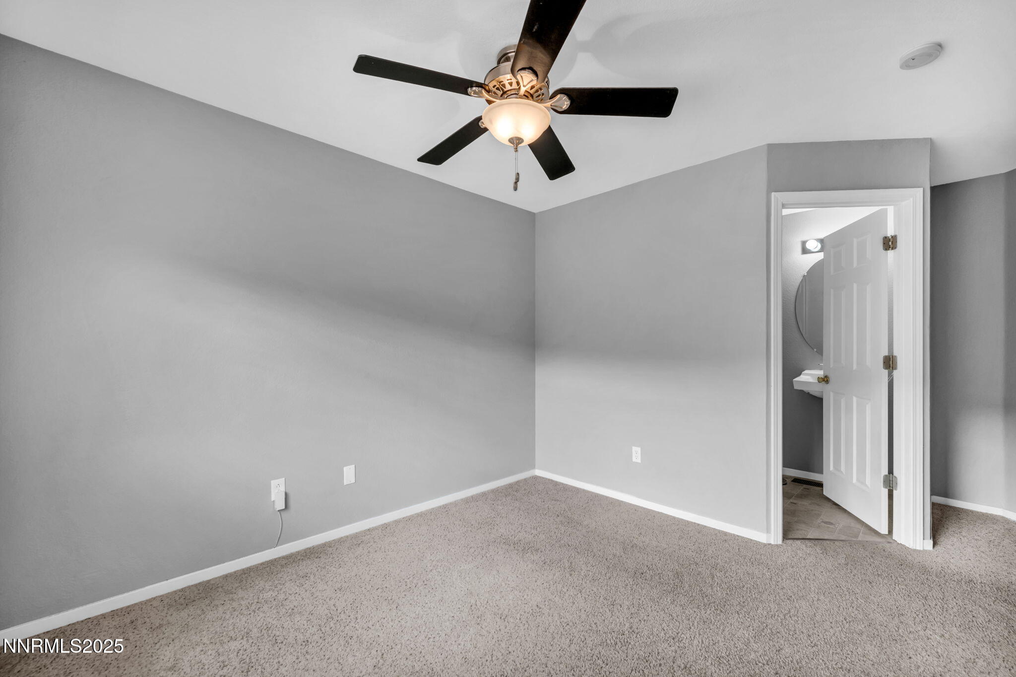 7644 Corso Street Reno, NV 89506 - Photo 42 of 54 an empty room with fan and a ceiling fan