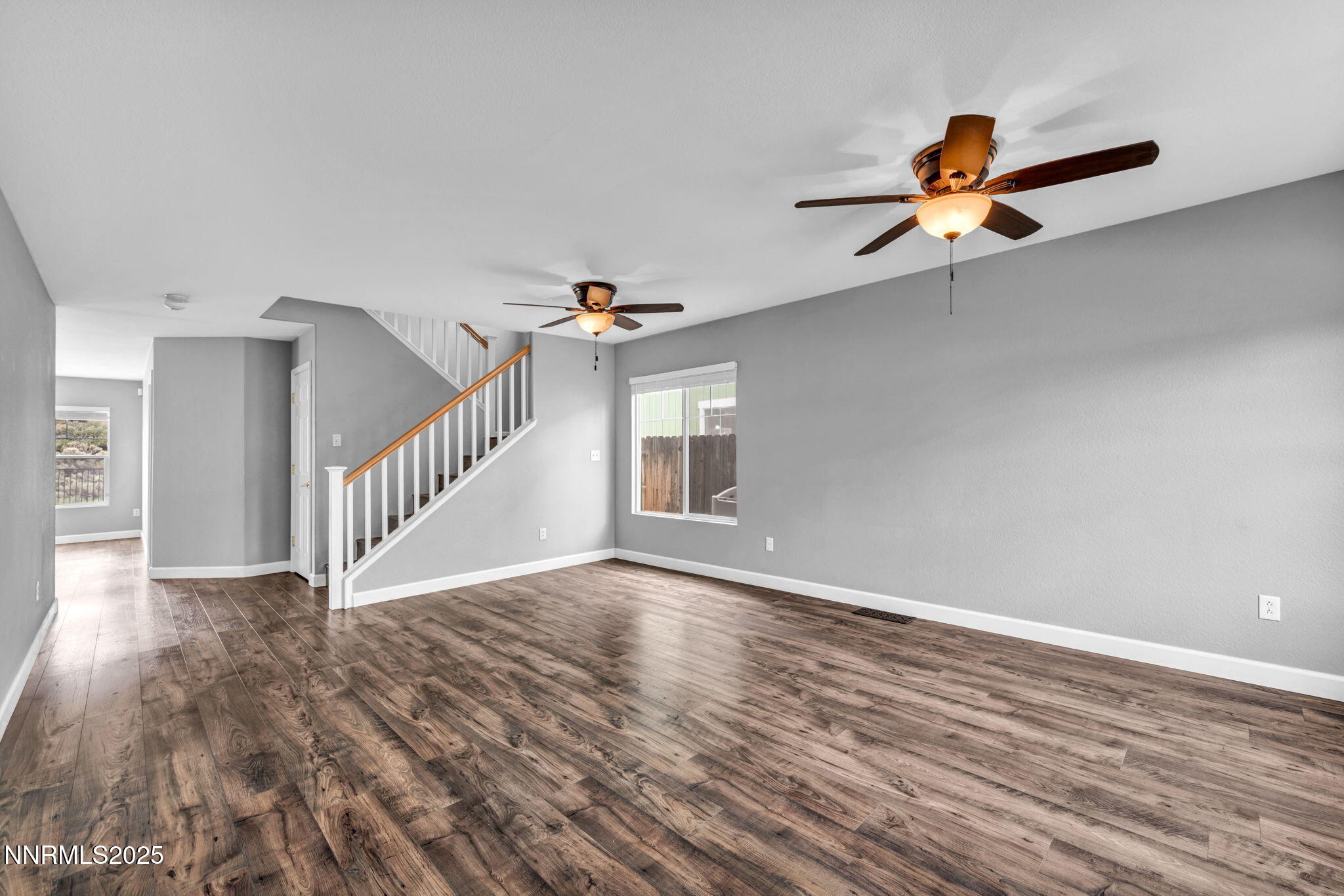 7644 Corso Street Reno, NV 89506 - Photo 48 of 54 a view of an empty room with wooden floor and a window
