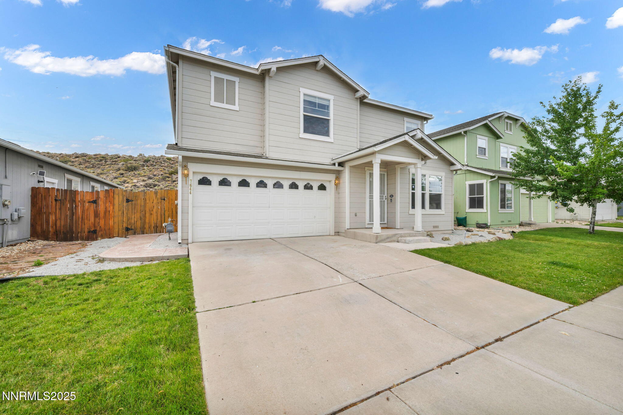 7644 Corso Street Reno, NV 89506 - Photo 6 of 54 a front view of a house with yard