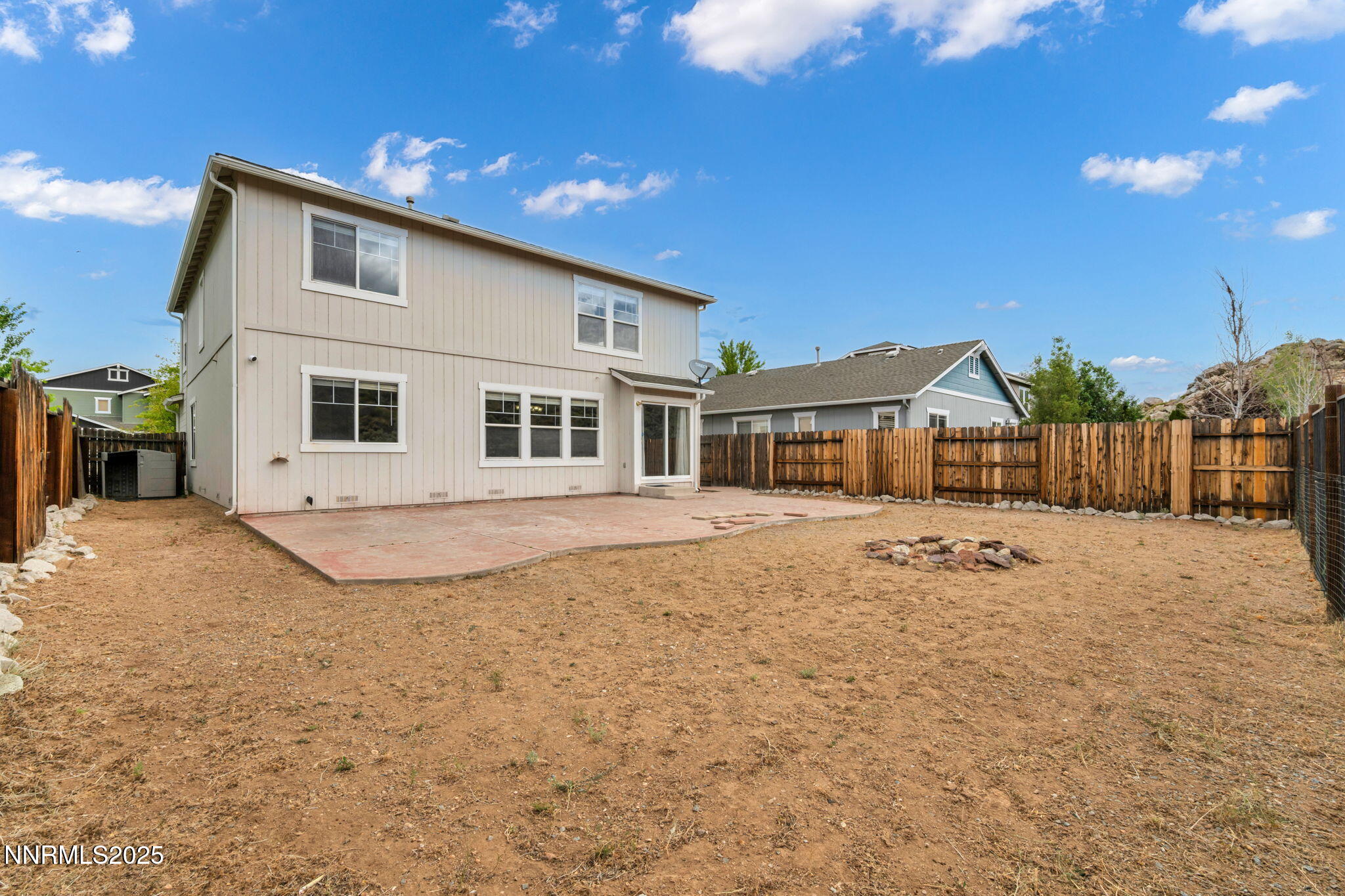 7644 Corso Street Reno, NV 89506 - Photo 7 of 54 a front view of a house with a yard