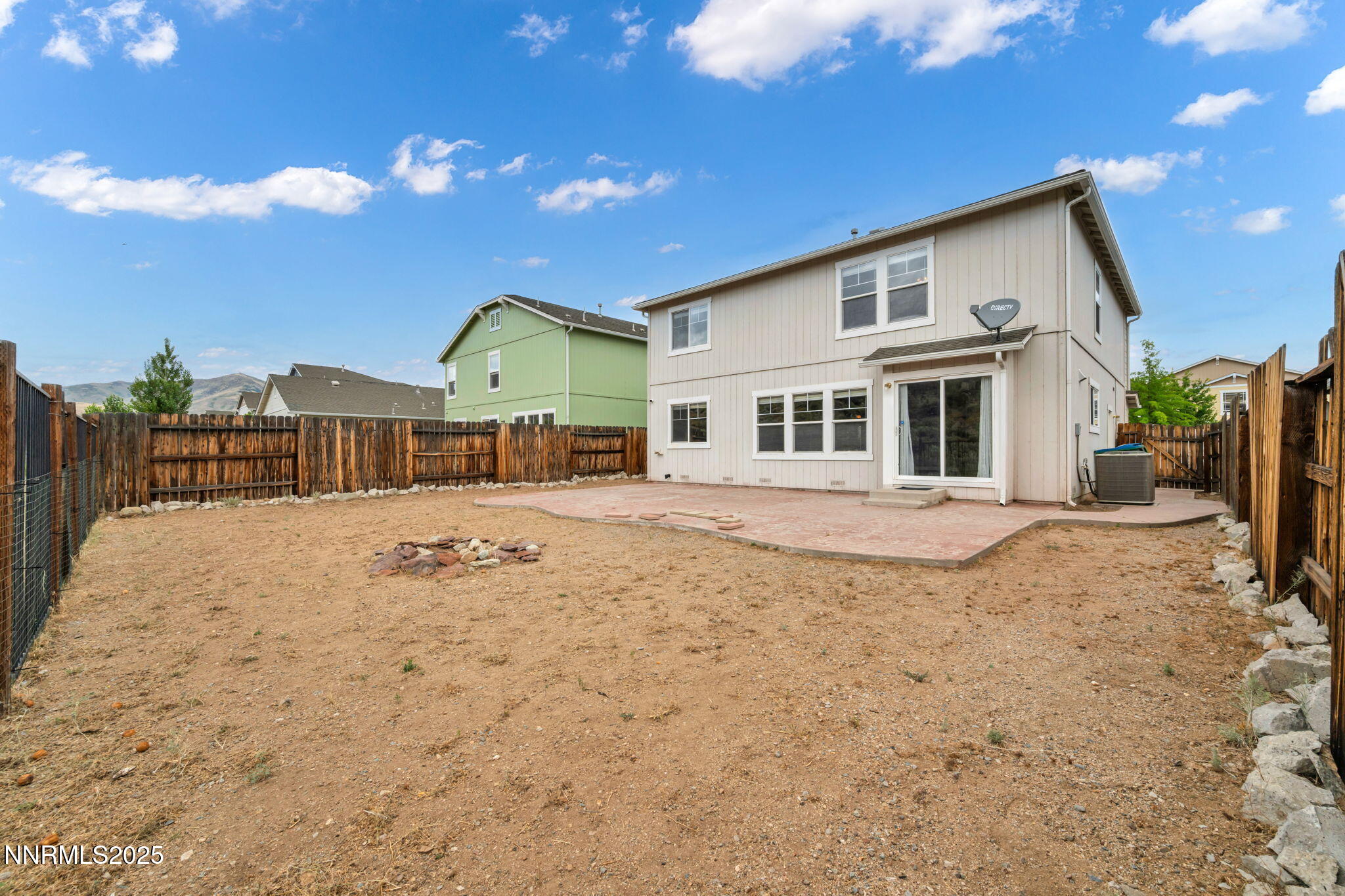 7644 Corso Street Reno, NV 89506 - Photo 10 of 54 a front view of a house with a yard