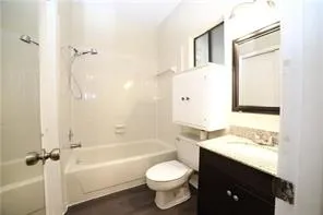 a bathroom with a granite countertop toilet sink and shower