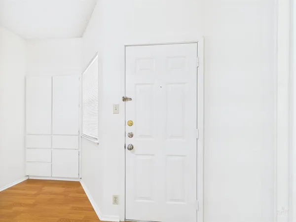 a view of entryway with wooden floor