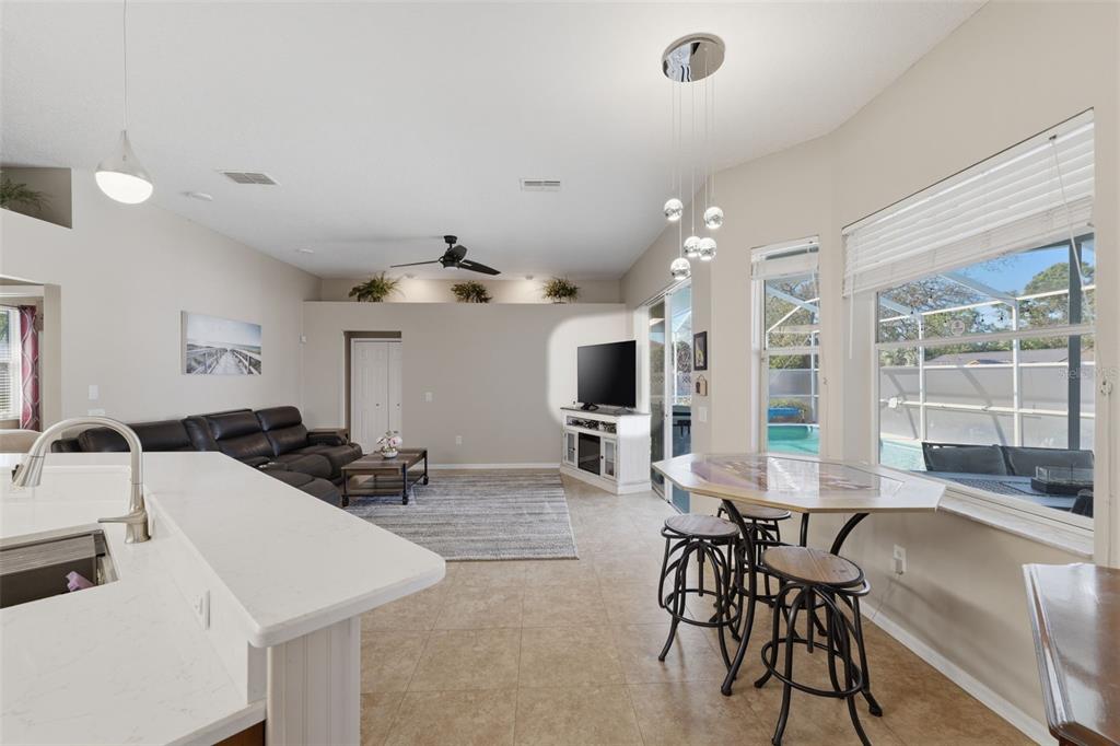 7442 Aloe Drive Spring Hill, FL 34607 - Photo 14 of 59 a living room with furniture and a large window