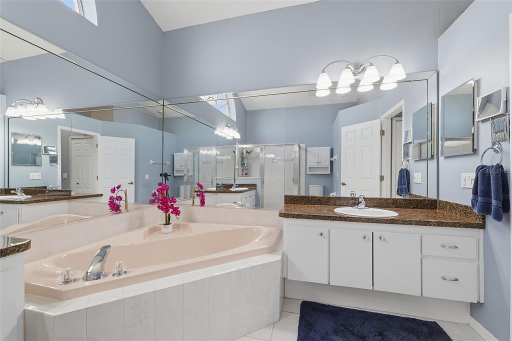 7442 Aloe Drive Spring Hill, FL 34607 - Photo 27 of 59 a bathroom with a sink double vanity and a mirror