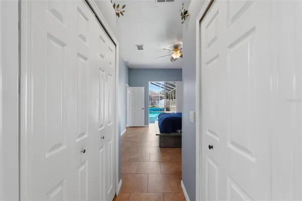 a bathroom with a sink a toilet a mirror and shower