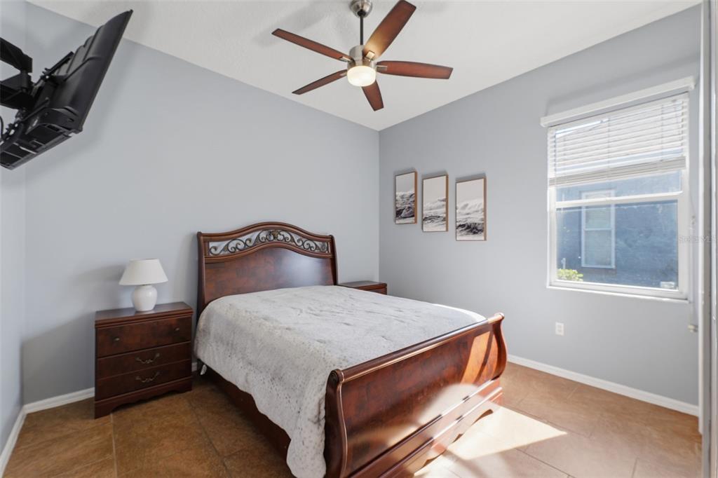 7442 Aloe Drive Spring Hill, FL 34607 - Photo 31 of 59 a bedroom with a bed and window