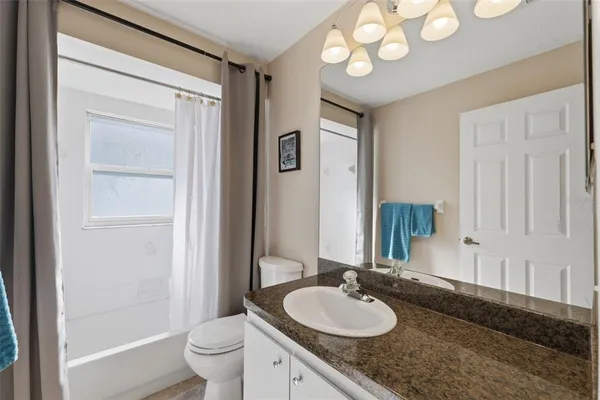 a view of a patio with table and chairs