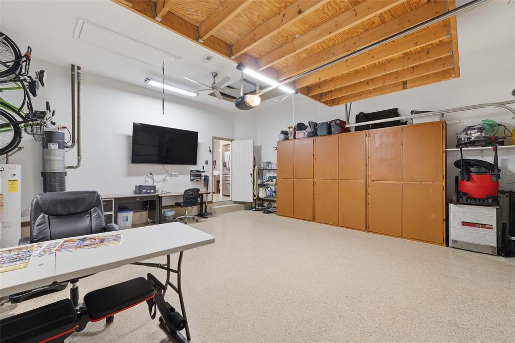 7442 Aloe Drive Spring Hill, FL 34607 - Photo 38 of 59 a livingroom with furniture and a flat screen tv