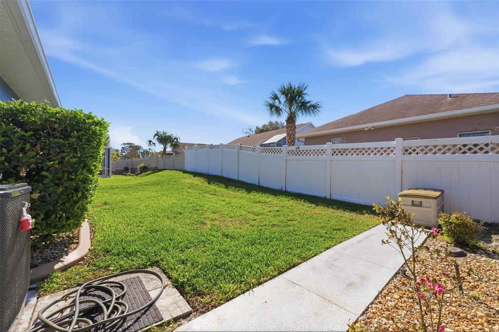7442 Aloe Drive Spring Hill, FL 34607 - Photo 45 of 59 a view of a backyard with potted plants