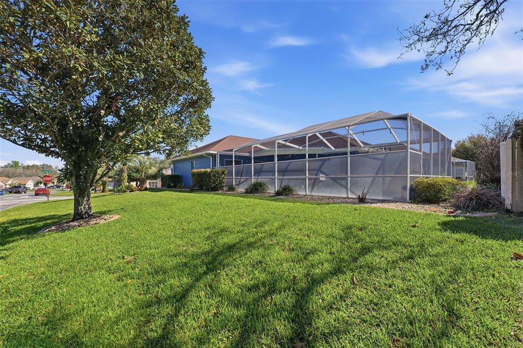 7442 Aloe Drive Spring Hill, FL 34607 - Photo 48 of 59 a view of a house with backyard and garden
