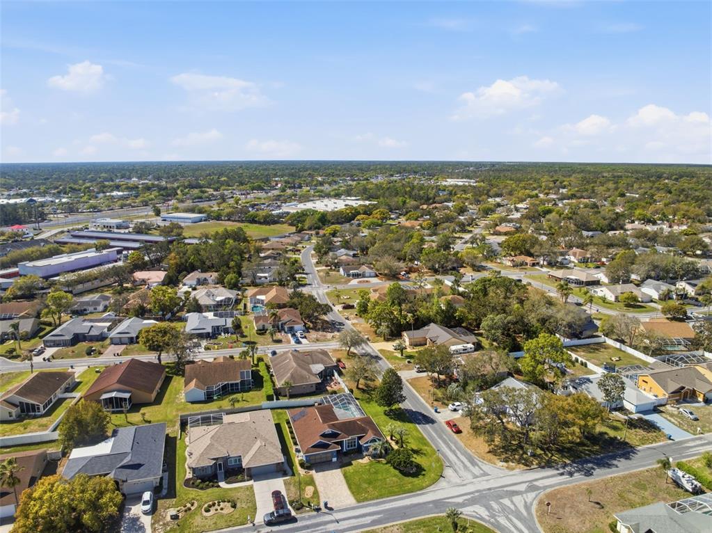 7442 Aloe Drive Spring Hill, FL 34607 - Photo 52 of 59 an aerial view of residential houses with outdoor space and trees