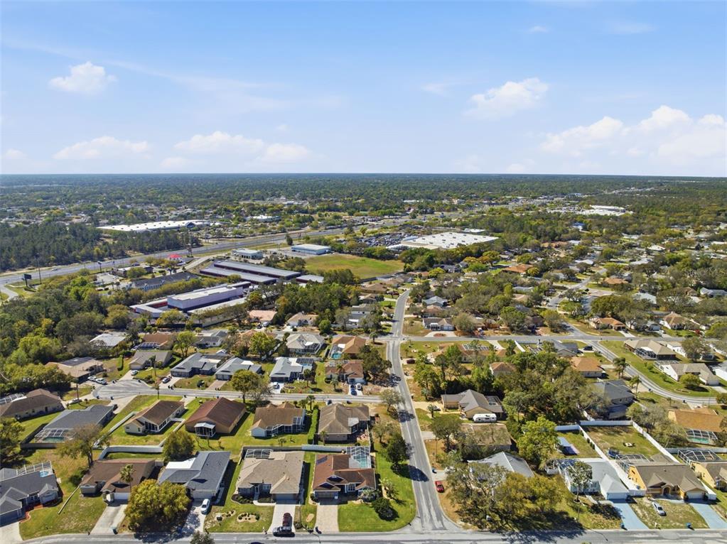 7442 Aloe Drive Spring Hill, FL 34607 - Photo 53 of 59 an aerial view of residential houses with outdoor space