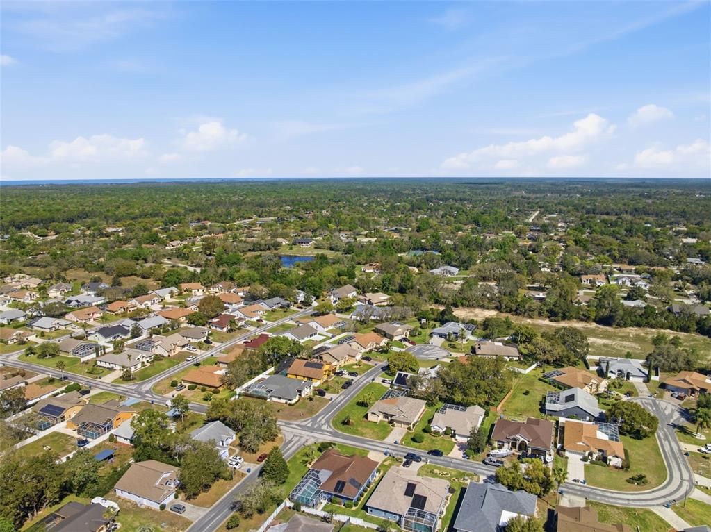 7442 Aloe Drive Spring Hill, FL 34607 - Photo 55 of 59 an aerial view of residential houses with outdoor space