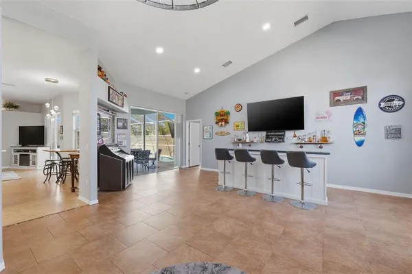 a view of a livingroom with furniture and a flat screen tv