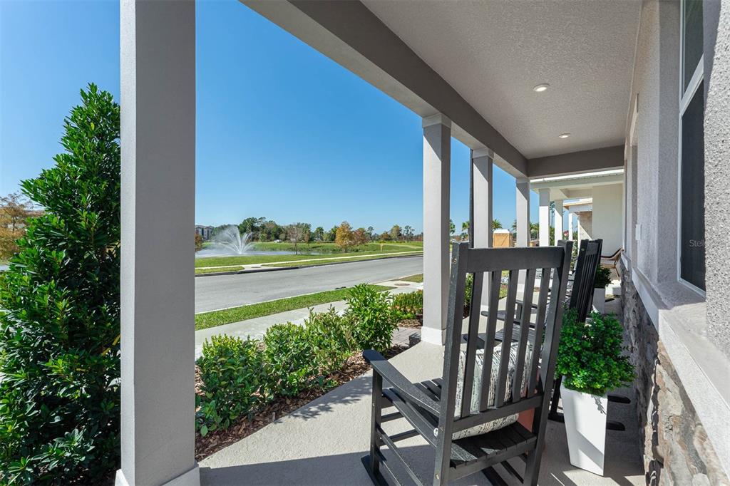 1808 Shadow Box Bend St. Cloud, FL 34771 - Photo 2 of 40 a view of a balcony with chair and wooden floor
