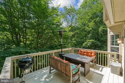 a view of balcony with furniture and trees