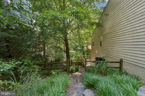 a backyard of a house with lots of green space