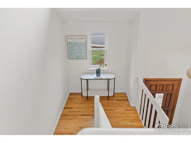 a bedroom with a bed and a table in it