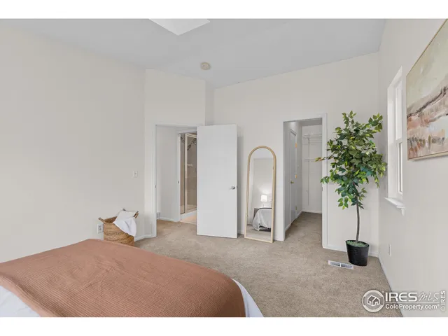 a living room with furniture and potted plant