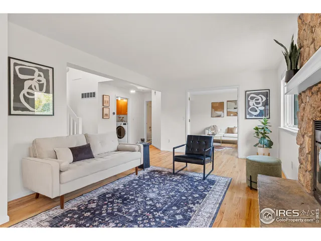 a living room with furniture and a rug