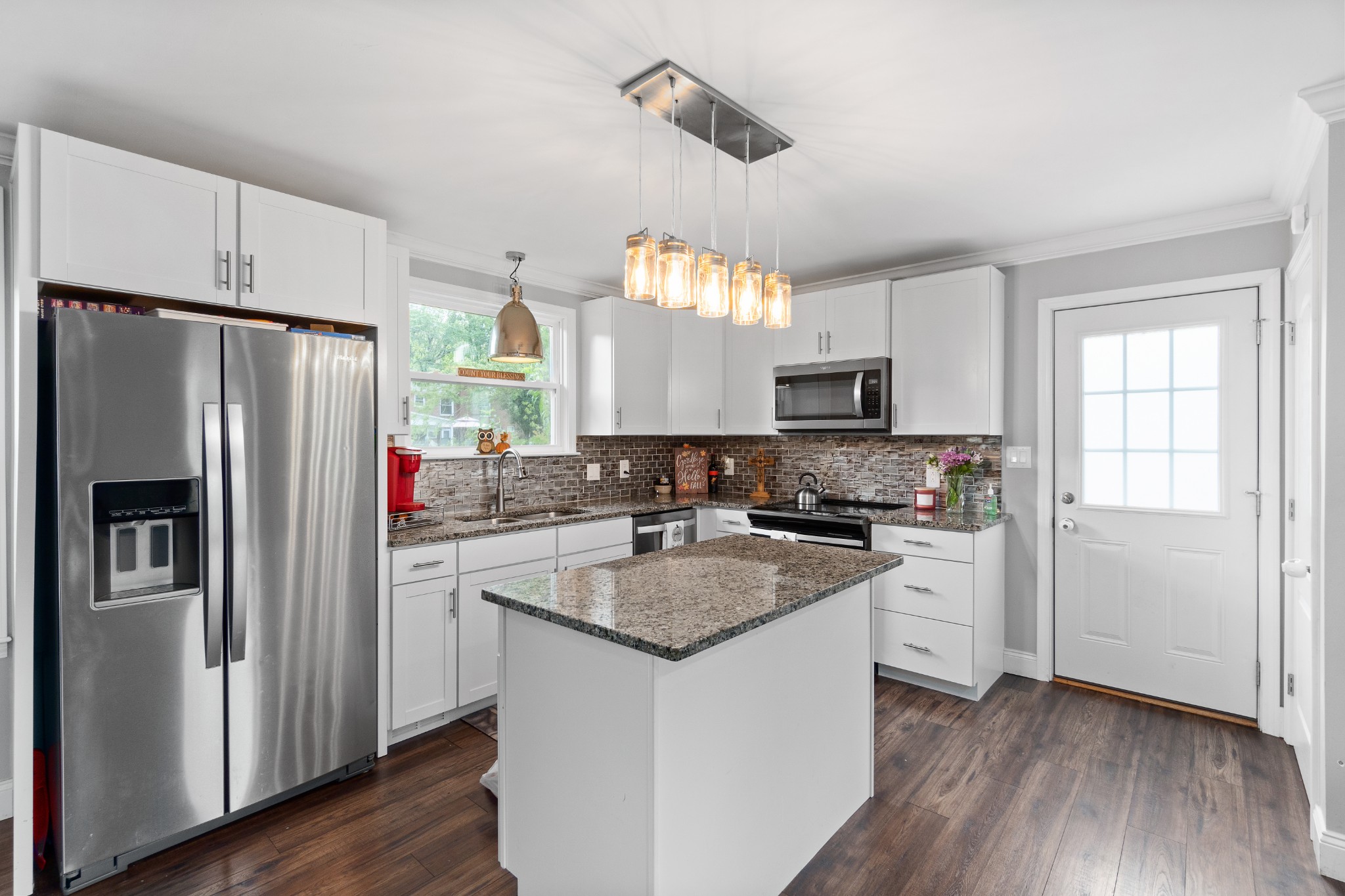2158 Post Road Clarksville, TN 37043 - Photo 11 of 30 a kitchen with granite countertop a refrigerator stove and sink
