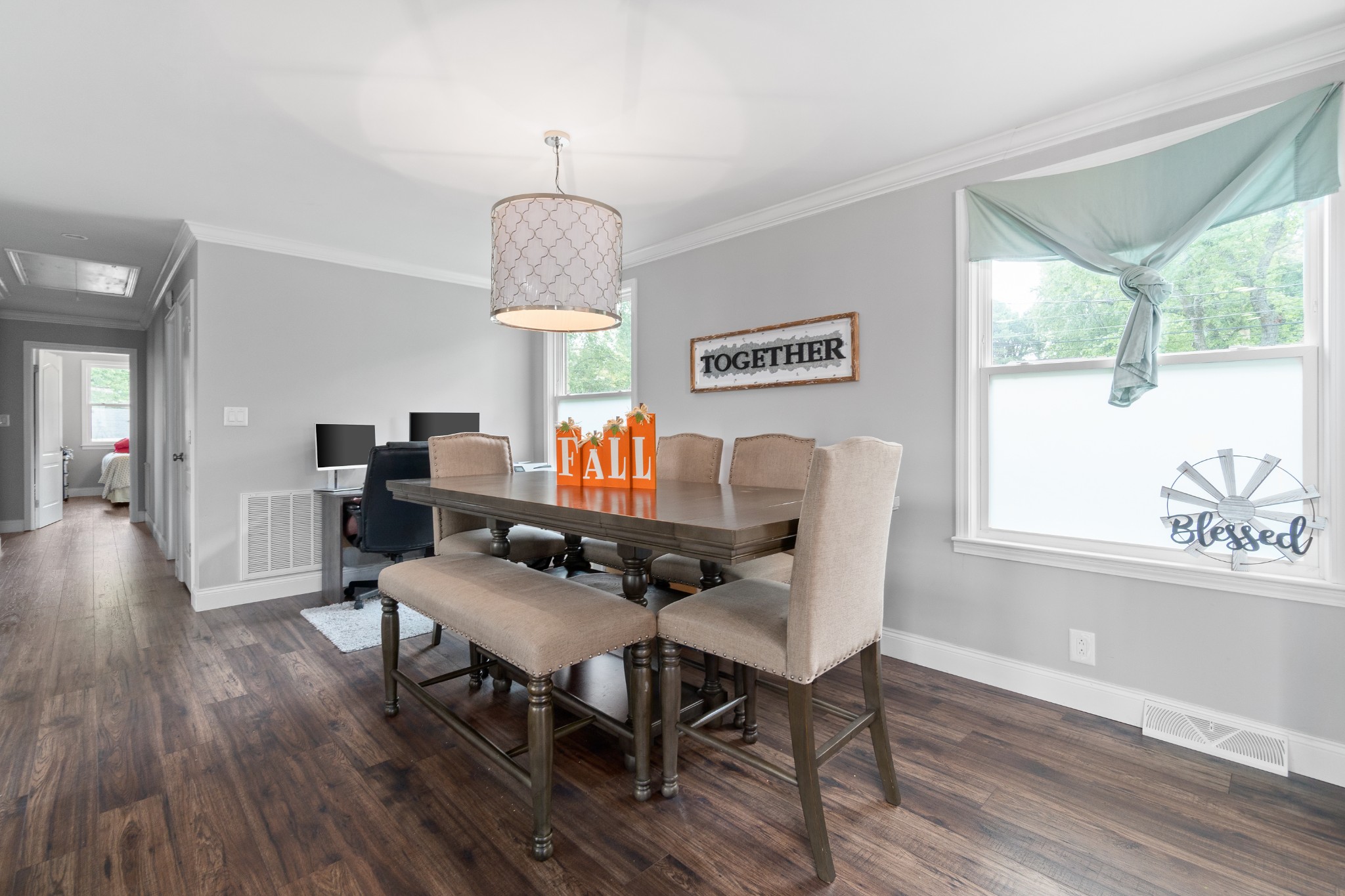 2158 Post Road Clarksville, TN 37043 - Photo 14 of 30 a dining room with wooden floor a chandelier a wooden table and chairs