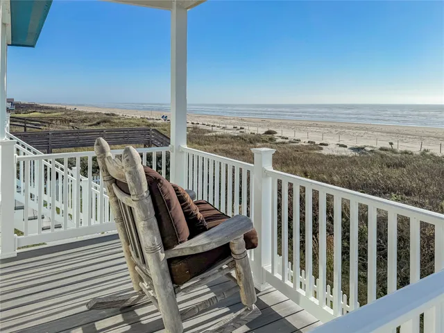 a view of roof deck with two chairs and wooden floor