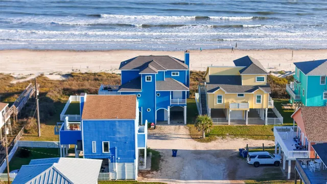 a aerial view of a house with a ocean view