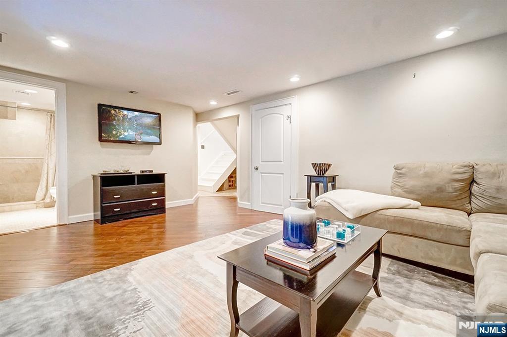 41 Demarest Avenue Demarest, NJ 07627 - Photo 21 of 28 a living room with furniture and a flat screen tv