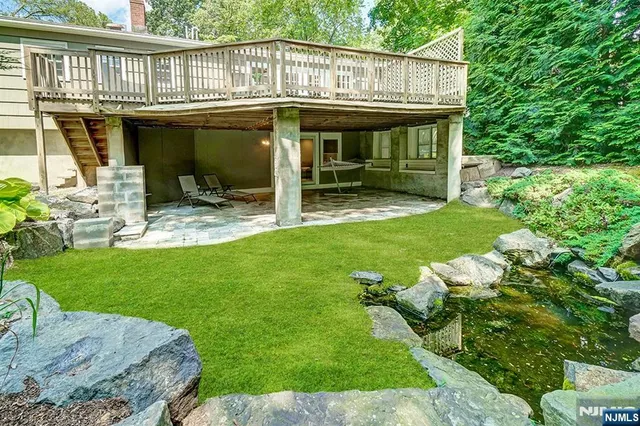 a view of a house with a yard porch and sitting area