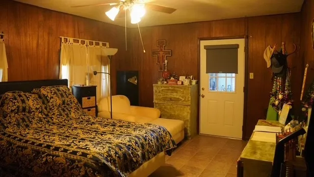 a bedroom with a bed and a lamp