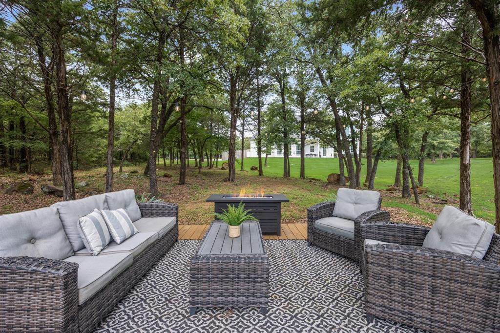 1619 Bloomfield Road Valley View, TX 76272 - Photo 32 of 39 Deck down by the pond and surrounded by nature.