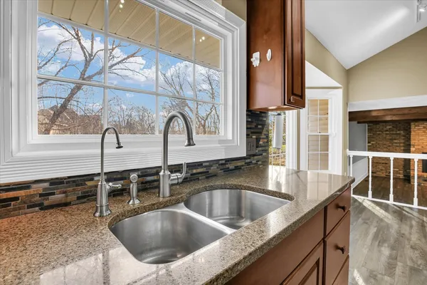 a view of a kitchen with a sink cabinets and a window