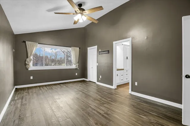 a view of an empty room and wooden floor