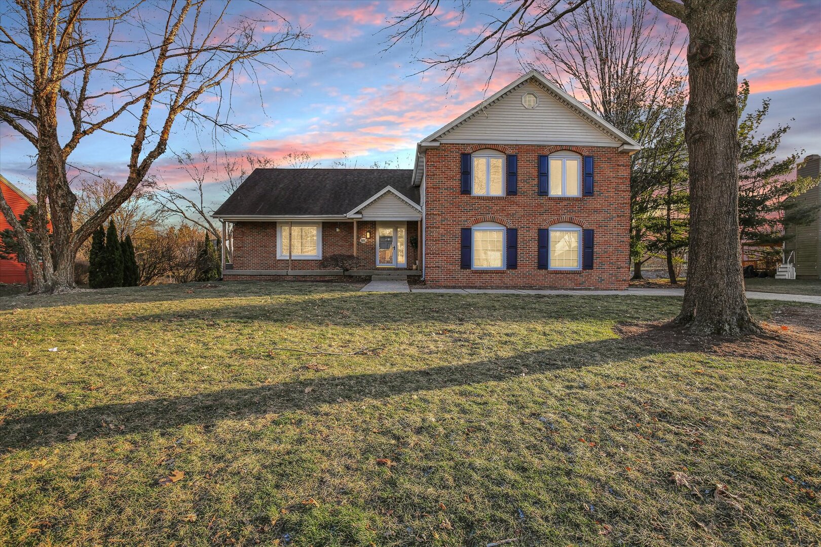 880 Stevens Creek Lane Forsyth, IL 62535 - Photo 3 of 56 a front view of a house with a yard