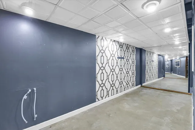 a view of a house with a yard and garage