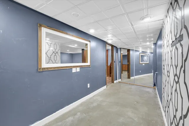 a view of a yard with wooden floor and large trees