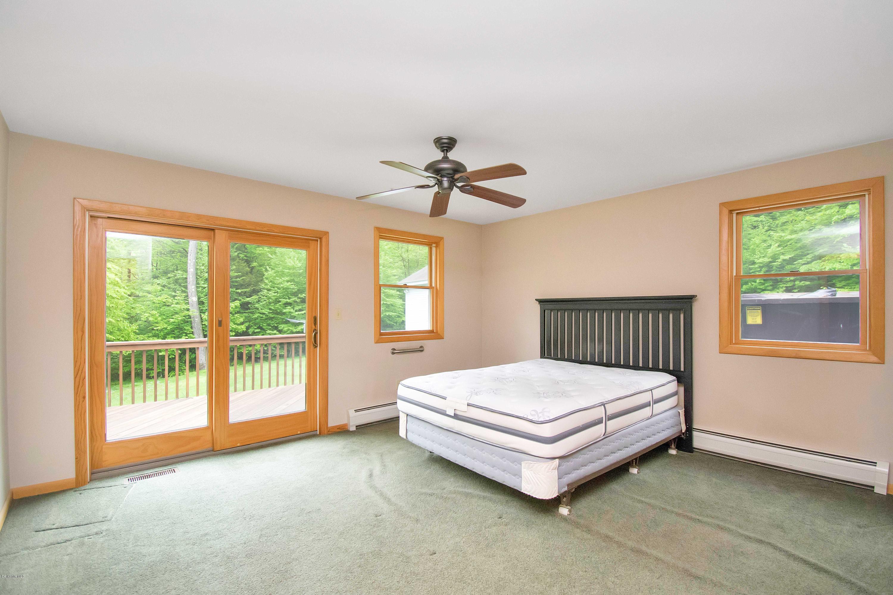 1565 Monterey Road Otis, MA 01253 - Photo 8 of 16 a bedroom with a bed and a window