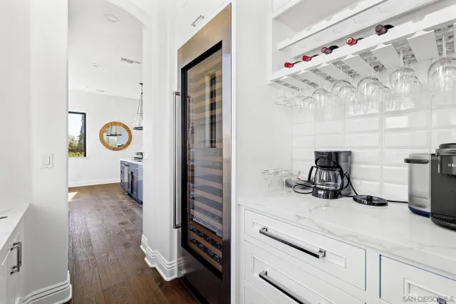 a kitchen with stainless steel appliances a stove a sink and a refrigerator